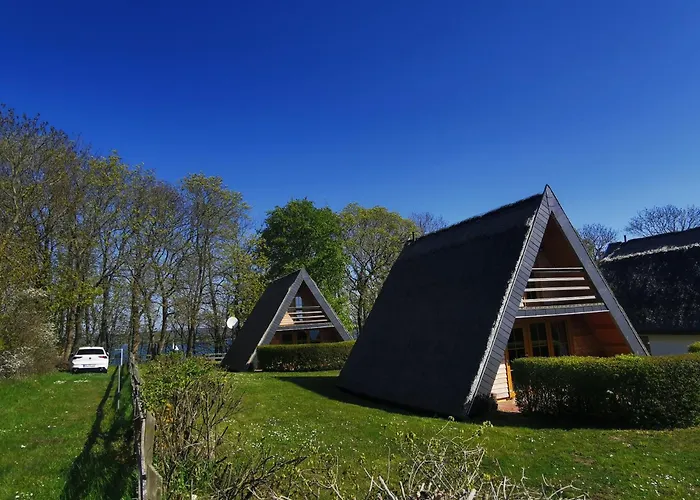 Reetdach Ferienhaeuser Casa de Férias *